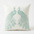 Ivory linen pillow cover with ocean-mint peacock silk embroidery, front view