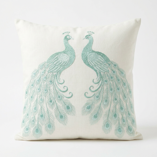 Ivory linen pillow cover with ocean-mint peacock silk embroidery, front view