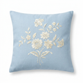 Baby-blue linen pillow cover with ivory silk floral embroidery, front view