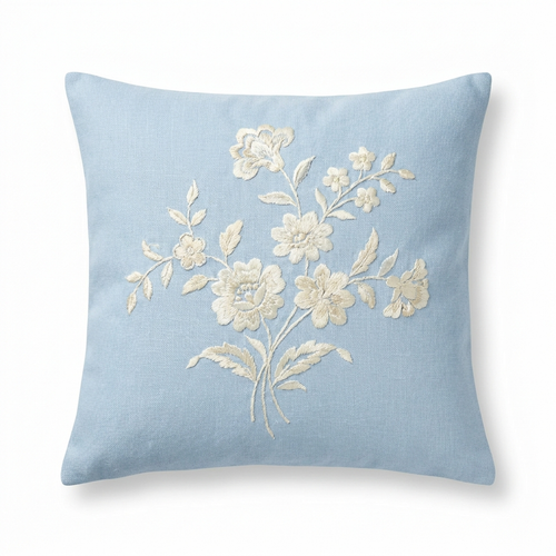 Baby-blue linen pillow cover with ivory silk floral embroidery, front view