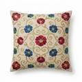 Neutral linen pillow cover with jewel-toned floral and gold embroidery, front view