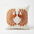 Ivory linen pillow cover with burnt-orange peacock silk embroidery, front view